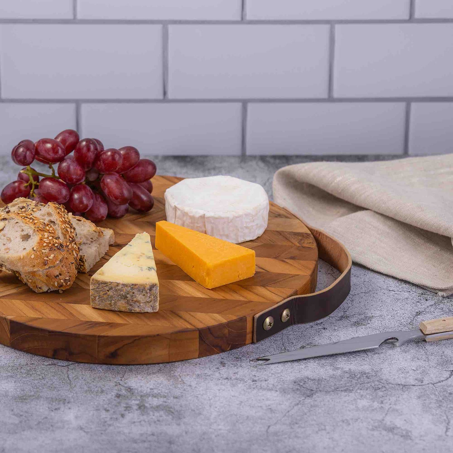 Handcrafted Herringbone Pattern Wooden Chopping Board with Leather Handle