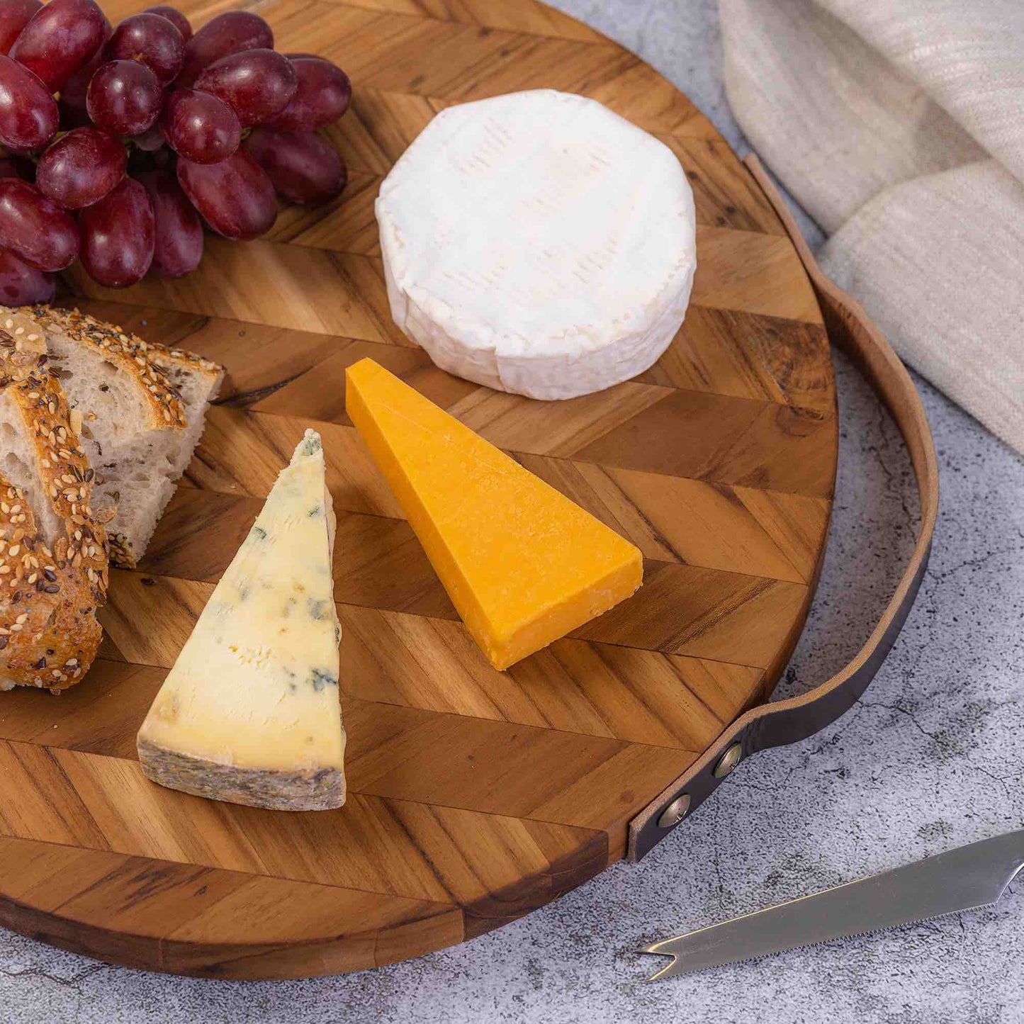 Handcrafted Herringbone Pattern Wooden Chopping Board with Leather Handle